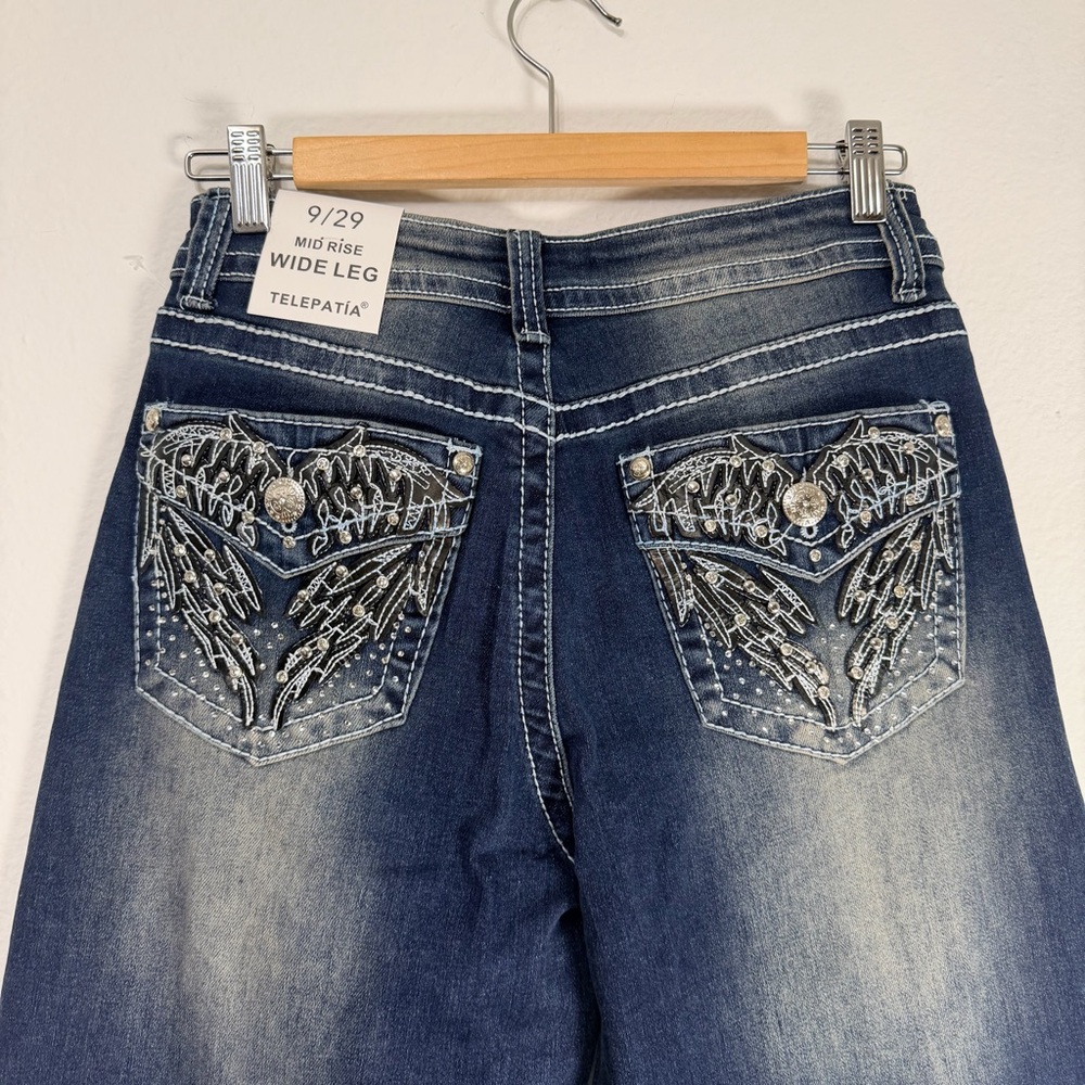Telepatía Women's mid-rise wide-leg jeans feature‎ an embellished pocket